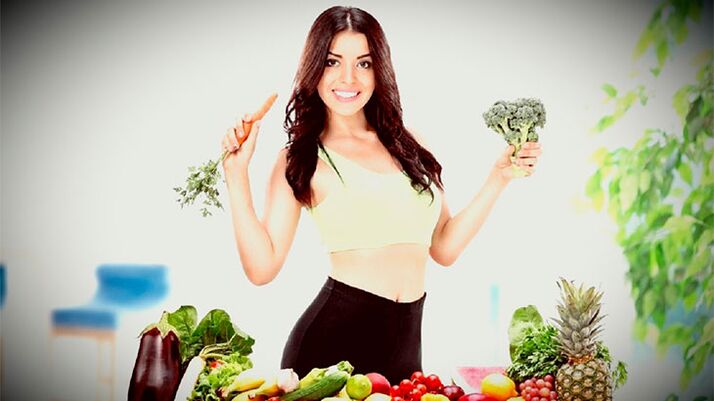 A slender girl with vegetables